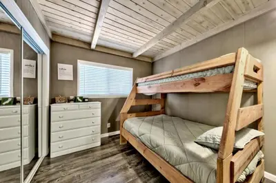 a bedroom with a bunk bed in a room at CYH0876 - Island Cabin cabin in South Lake Tahoe