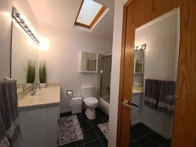a bathroom with a sink and a toilet and a shower at IVH0869 - Cinnabar Creek home in Incline Village