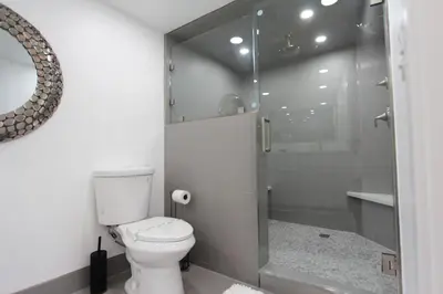 a bathroom with a toilet and a glass shower at LVC0615 - Lake Therapy condo in Zephyr Cove