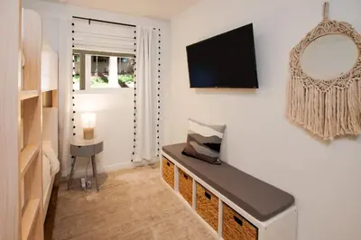 a living room with a tv on a wall at Golden Antler Escape - Minutes to the Beach in Incline Village