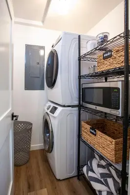 a laundry room with a washer and a microwave at Golden Antler Escape - Minutes to the Beach in Incline Village