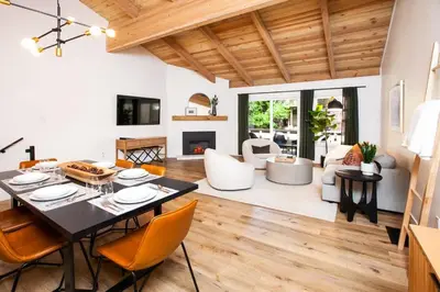 a dining room and living room with a table and chairs at Golden Antler Escape - Minutes to the Beach in Incline Village
