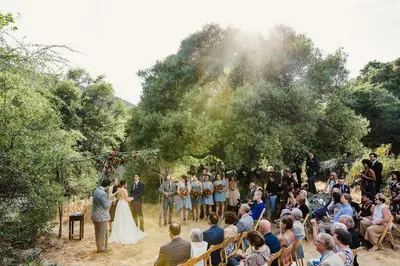a bride and groom walking down the aisle at their wedding at Spacious and Luxurious Barn in Three Rivers, California in Three Rivers