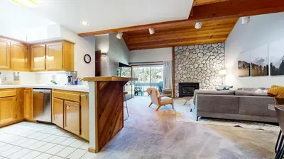 a kitchen and living room with a couch at Snowcreek IV #594 condo in Mammoth Lakes