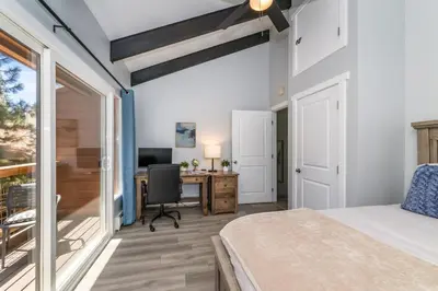 a bedroom with a bed and a desk with a computer at Mountain Retreat - Lake Tahoe - Incline Village - Private Garage in Incline Village