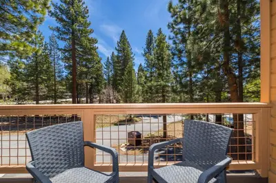 two chairs on a screened in porch with trees at Mountain Escape - Lake Tahoe - Incline Village - Private Garage in Incline Village