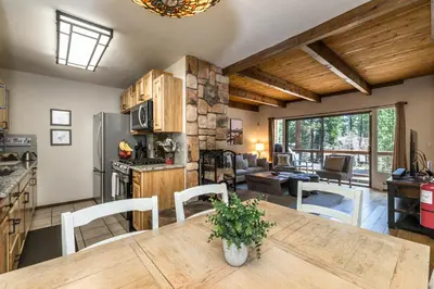 a kitchen and living room with a table and chairs at Mountain Escape - Lake Tahoe - Incline Village - Private Garage in Incline Village