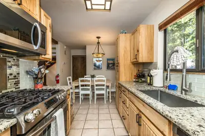 a kitchen with a sink and a stove top oven at Mountain Escape - Lake Tahoe - Incline Village - Private Garage in Incline Village