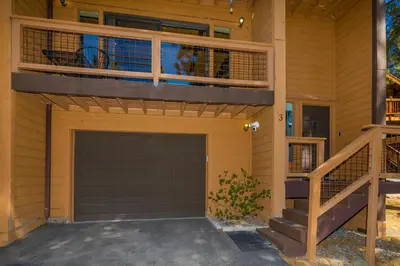 a balcony on a house with a garage at Mountain Getaway - Lake Tahoe - Incline Village - Private Garage in Incline Village
