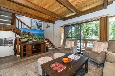 a living room with a couch and a table at Mountain Getaway - Lake Tahoe - Incline Village - Private Garage in Incline Village