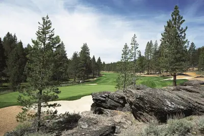 a view of a golf course with trees and a green at Luxury Home Walk to Ski Lifts 6 Pools Food Private Hot-Tub Yard Fun Bunk Room in Truckee