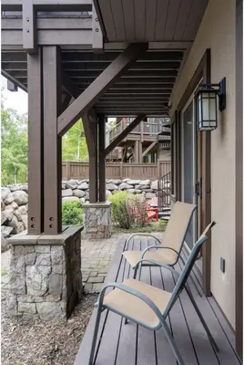 a group of chairs sitting on a patio at Luxury Home Walk to Ski Lifts 6 Pools Food Private Hot-Tub Yard Fun Bunk Room in Truckee