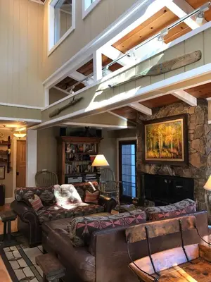 a living room with couches and a fireplace at Lake Front-Near Yosemite-Pool Table-Private Dock -PML in Groveland