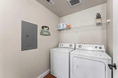 a laundry room with a washer and dryer at NEW Chic 2BR Stay with Heated Pool Gym & Mini Golf in Steamboat