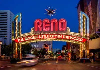 a sign that reads reno the biggest little city in the world at NEW Chic 2BR Stay with Heated Pool Gym & Mini Golf in Steamboat