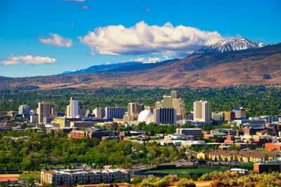 a view of a city with a mountain in the background at NEW Chic 2BR Stay with Heated Pool Gym & Mini Golf in Steamboat