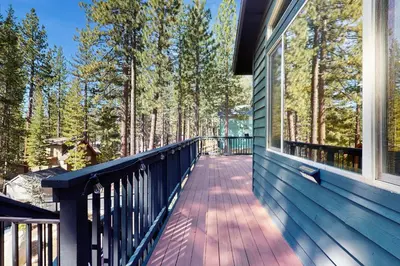 a walkway on a house with a window at The Tahoe Timber House in South Lake Tahoe