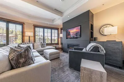 a living room with a couch and a fireplace at Iron Horse Lodge South 302 by East West Hospitality in Truckee