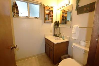 a bathroom with a sink and a toilet and a mirror at HCC0612 - Sitzmark Ski Condo townhouse in South Lake Tahoe