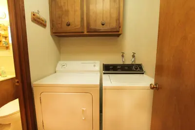 a small kitchen with a stove and a refrigerator at HCC0612 - Sitzmark Ski Condo townhouse in South Lake Tahoe