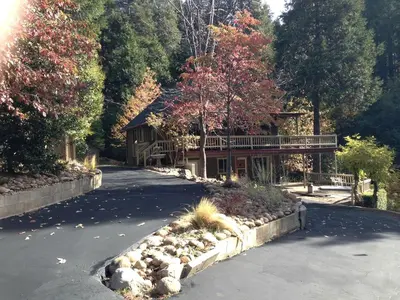 a house on the side of a road at Gorgeous Cabin Rental with Spacious Furnished Deck in Pioneer, California in Pioneer