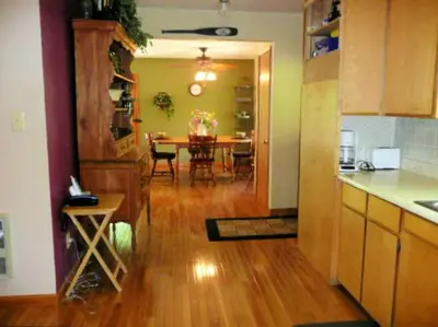 a kitchen and dining room with a table and a dining room at Gorgeous Cabin Rental with Spacious Furnished Deck in Pioneer, California in Pioneer