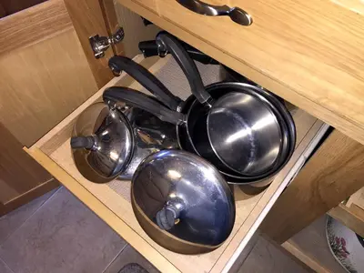 a pot and pans sitting in a drawer at Luxury Cabin Rental with a Fire Pit in Coulterville, California in Coulterville