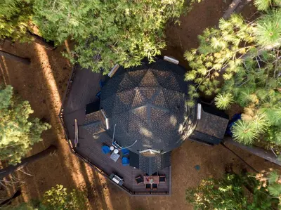 an overhead view of a backyard with a table and cars at Secluded Dome Rental Surrounded by Stunning Nature near Arnold, California in Arnold
