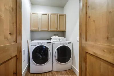 a washer and dryer in a small laundry room at Near Downhill Ski Resort! Hot Tub Haven in Truckee in Truckee