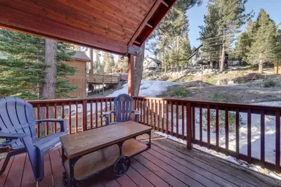 a wooden porch with a bench and two chairs on it at Near Downhill Ski Resort! Hot Tub Haven in Truckee in Truckee