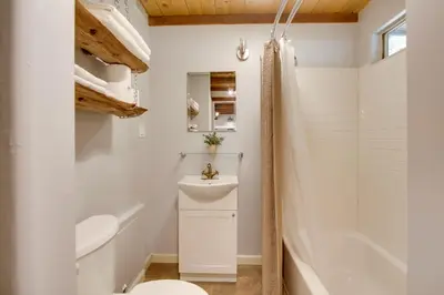 a bathroom with a toilet sink and a shower at Walk to Riverfront Beach Kernville Escape in Kernville