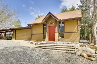 a house with a red door and a driveway at Walk to Riverfront Beach Kernville Escape in Kernville