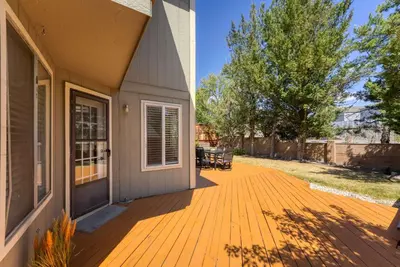 a porch of a house with a wooden deck at Cozy 3BR Family Home with Patio & BBQ grill Close to Casinos and Shops in Reno