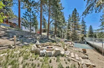 a backyard with a fire pit and trees at Experience Zephyr Cove Retreat Relax Enjoy #6 in Zephyr Cove