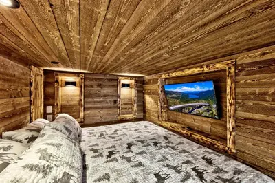 a bedroom with a bed and a large window at First level studio Unit #7 close to everything bike, ski, swim Zephyr Cove! in Zephyr Cove