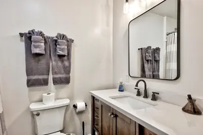 a bathroom with a sink and a toilet and a mirror at First level studio Unit #7 close to everything bike, ski, swim Zephyr Cove! in Zephyr Cove