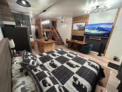 a bedroom with a bed with a blanket on it at First level studio Unit #7 close to everything bike, ski, swim Zephyr Cove! in Zephyr Cove