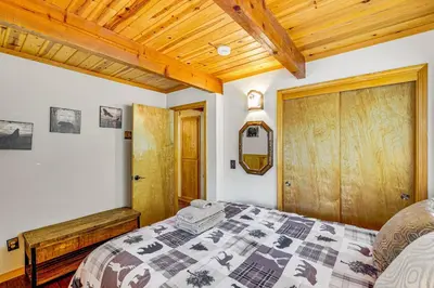 a bedroom with a bed and a wooden ceiling at Game Room Blue Lake Mountain Retreat in Arnold in Arnold