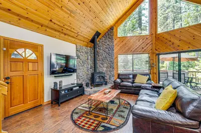 a living room with leather furniture and a fireplace at Game Room Blue Lake Mountain Retreat in Arnold in Arnold