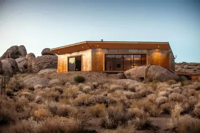 a house on top of a hill with rocks at Stunning Lone Pine Accommodation for Romantic Getaways in California in Lone Pine