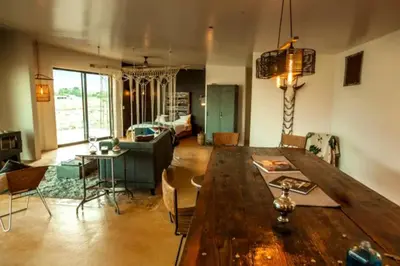 a living room with a large wooden table and chairs at Stunning Lone Pine Accommodation for Romantic Getaways in California in Lone Pine