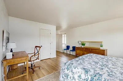 a bedroom with a bed and a desk and a dresser at Modern Mountain Escape in South Lake Tahoe