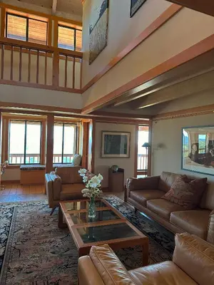 a living room with couches and a coffee table at Priest Ranch with Guest House and Pool in Big Oak Flat
