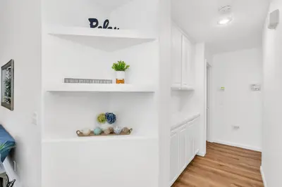 a white hallway with white walls and white shelves at University Pastoral - Family Perfect Close to UCM in Merced