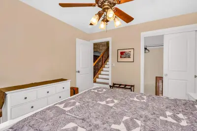 a bedroom with a bed and a ceiling fan at A Tuscan Adventure in California 3 BDR Sleeps 8 in Shaver Lake