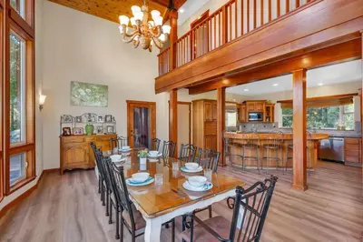 a dining room with a table and chairs at Gorgeous 5 BDR Traviloli Mountain Retreat for 10 in Shaver Lake