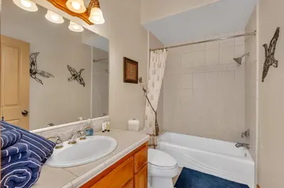a bathroom with a sink and a tub and a toilet at Gorgeous 5 BDR Traviloli Mountain Retreat for 10 in Shaver Lake