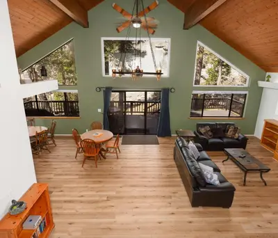 a living room with a couch and a table at Granite View Lodge - Minutes from Water in Shaver Lake