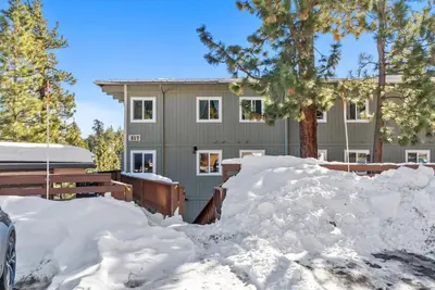 a house with a pile of snow in front of it at HNC0617 - Stagecoach Summit Retreat condo in Stateline