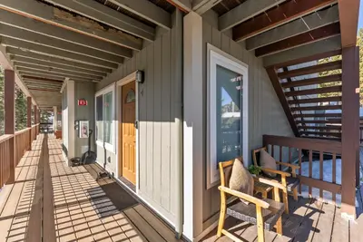 a porch of a house with two chairs on it at HNC0617 - Stagecoach Summit Retreat condo in Stateline